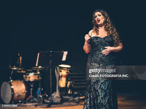 opera singer performing on the stage - opera singer stock pictures, royalty-free photos & images