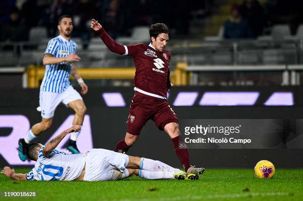Simone Verdi of Torino FC is tackled by Nenad Tomovic of SPAL during the Serie A football match between Torino FC and SPAL. SPAL won 2-1 over Torino...