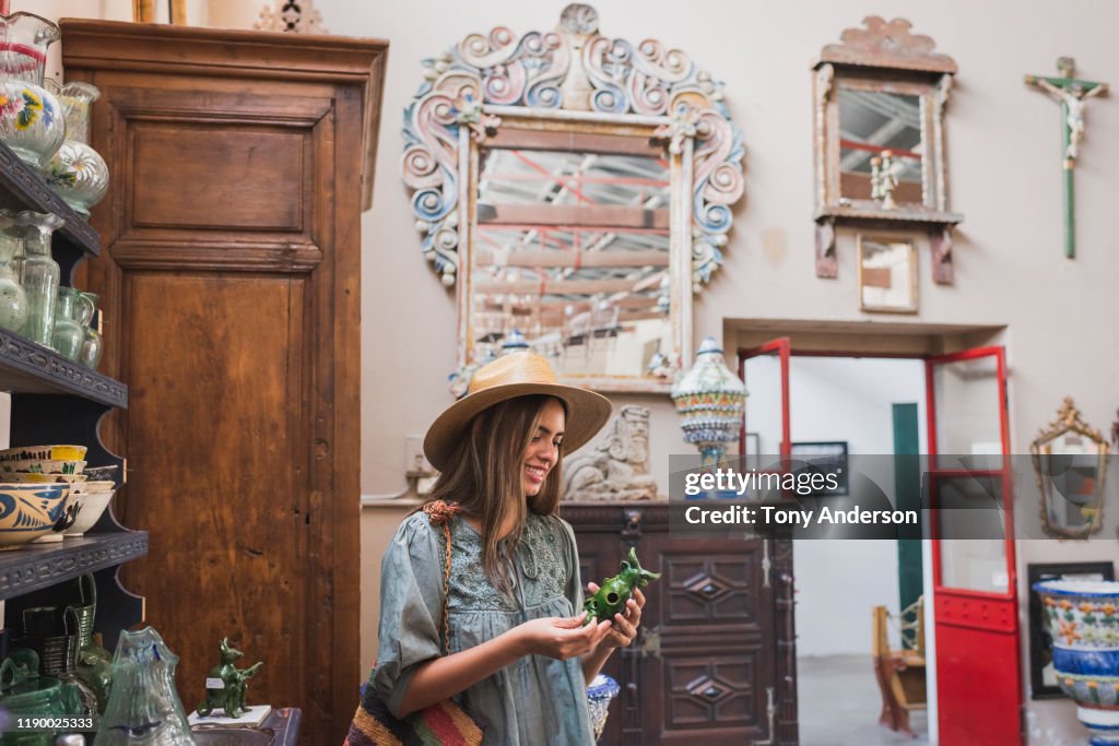 Woman shopping in antique store