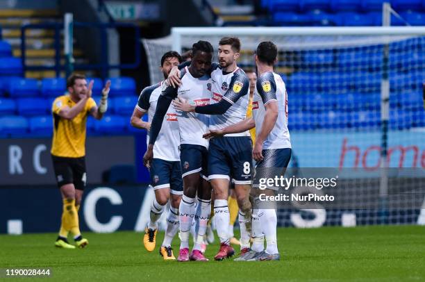 Bolton Wanderers forward Joe Dodoo is congratulated after scoring to make the score 1-1 during the Sky Bet League 1 match between Bolton Wanderers...