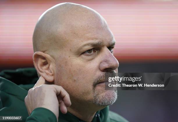 Defensive coordinator Mike Pettine of the Green Bay Packers looks on during pregame warms up prior to the game against the San Francisco 49ers at...