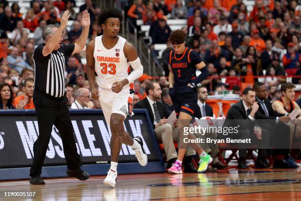 Elijah Hughes of the Syracuse Orange reacts after making a three point basket during the first half of an NCAA basketball game against the Bucknell...