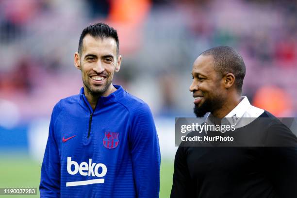Seydou Keita and Sergio Busquets during La Liga match between FC Barcelona and Deportivo Alaves at Camp Nou on December 21, 2019 in Barcelona, Spain.