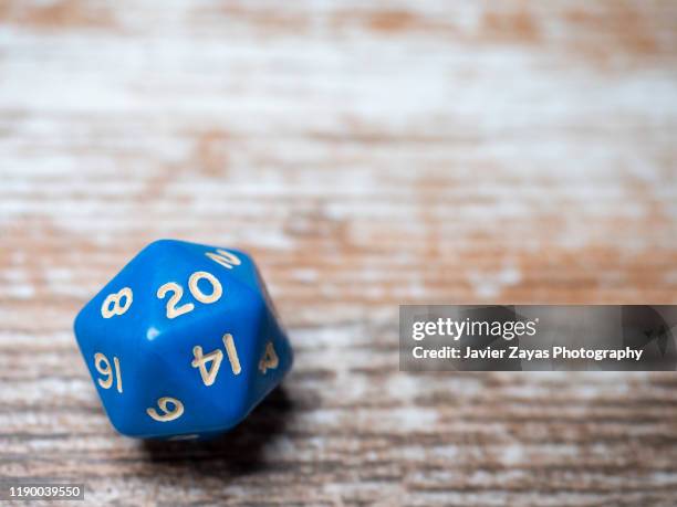 6-sided die on old wooden table - number 20 ストックフォトと画像