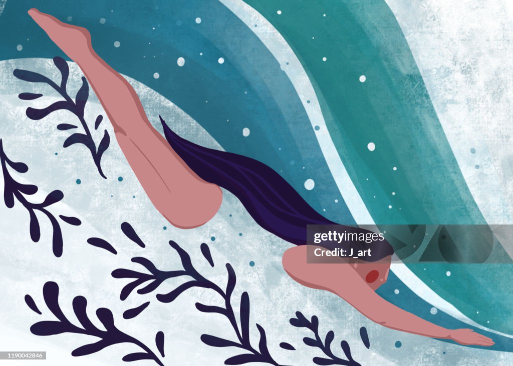 Woman Swimming underwater.