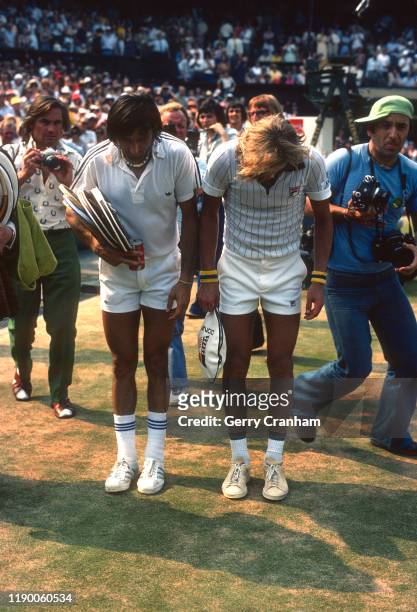 July 1976 Wimbledon - All England Lawn Tennis Championships - finalists Ilie Nastase and Bjorn Borg bow to the royal box. "n