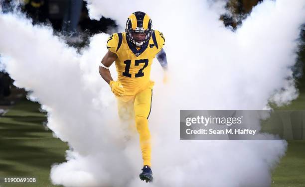 Wide receiver Robert Woods of the Los Angeles Rams runs on to the field before the game against the Baltimore Ravens at Los Angeles Memorial Coliseum...