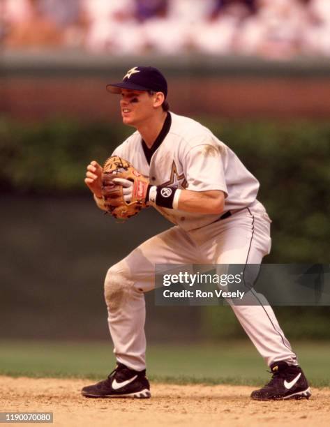 Craig Biggio of the Houston Astros fields during an MLB game versus the Chicago Cubs at Wrigley Field in Chicago, Illinois during the 1998 season.