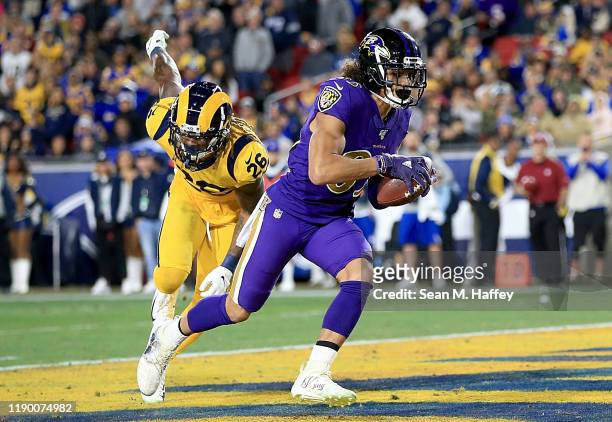 Wide receiver Willie Snead of the Baltimore Ravens catches a pass for a touchdown over defensive back Marqui Christian of the Los Angeles Rams in the...