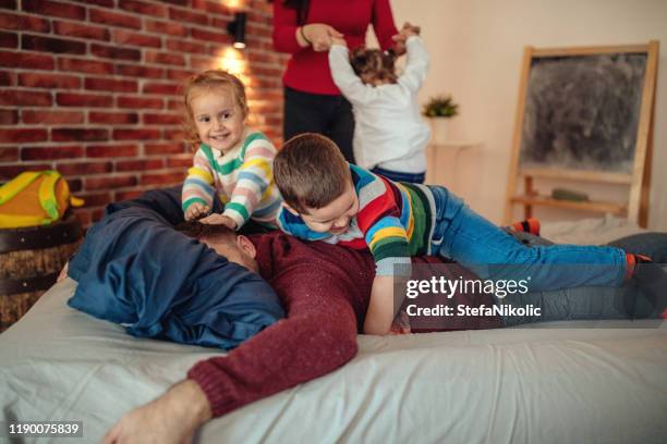 our morning game - father and child and pillow fight stock pictures, royalty-free photos & images