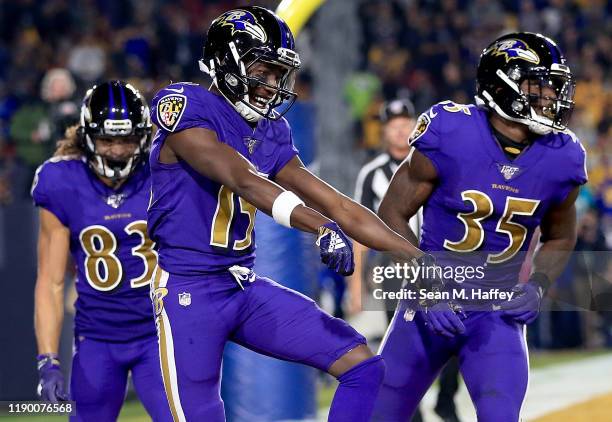 Wide receiver Marquise Brown of the Baltimore Ravens celebrates his first touchdown in the first quarter of the game against the Los Angeles Rams at...