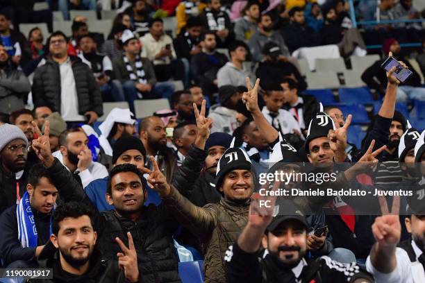 Juventus supporters pose for a photo during the Italian Supercup match between Juventus and SS Lazio at King Saud University Stadium on December 22,...