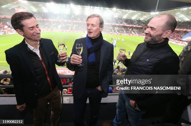 Of the Deutz champagne house Fabrice Rosset , and Morgan Robuchon and Patrick Rosset of Deutz, drink a glass of champagne prior to kick-off of the...