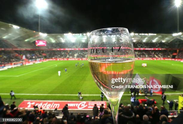 Picture shows a champagne glass prior to kick-off of the French L1 football match between Reims and Lyon on December 21 at the Auguste Delaune...