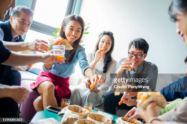 colleagues enjoy their lunch - political party stock pictures, royalty-free photos & images