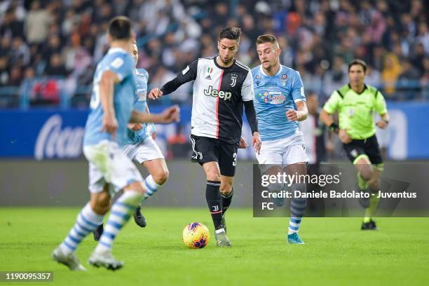 Rodrigo Bentancur of Juventus competes for the ball with Sergej Milinkovic-Savic of SS Lazio during the Italian Supercup Final match between Juventus...