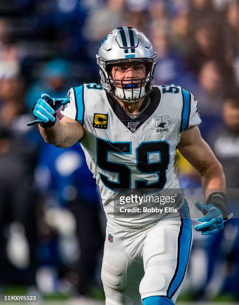 Luke Kuechly of the Carolina Panthers calls out a defensive scheme during the first quarter of the game against the Indianapolis Colts at Lucas Oil...