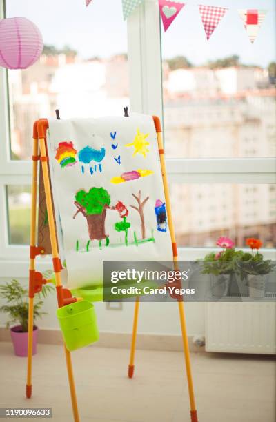 child painting in art class - kids drawing easel stock pictures, royalty-free photos & images