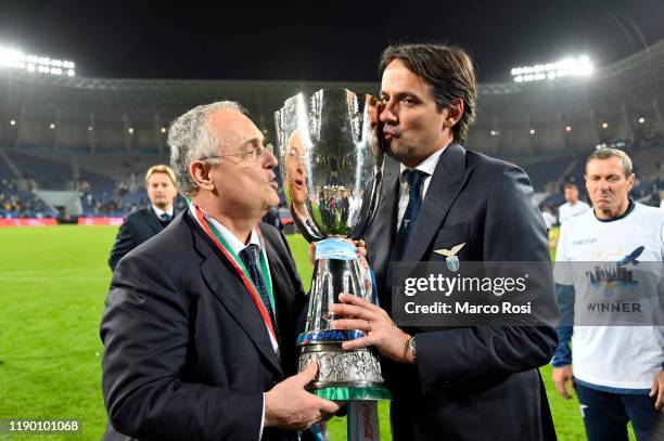 President of SS Lazio Claudio Lotito and head coach of SS Lazio Simone Inzaghi celebrate the winning of the Italian Supercup with the trophy after...