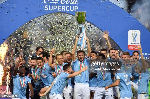 Players of SS Lazio celebrate the winning of Supercup with the trophy after the Italian Supercup match between Juventus and SS Lazio at King Saud...