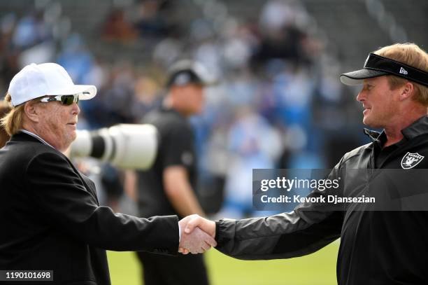 Oakland Raiders owner Mark Davis greets head coach Jon Gruden of the Oakland Raiders before the start of the game against Los Angeles Chargers at...