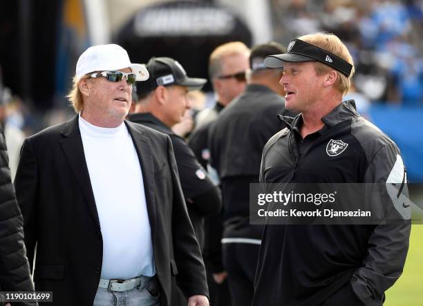 Oakland Raiders owner Mark Davis greets head coach Jon Gruden of the Oakland Raiders before the start of the game against Los Angeles Chargers at...