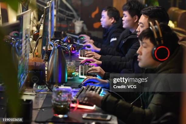 People play computer games at an Internet Cafe on March 1, 2019 in Fuyang, Anhui Province of China.