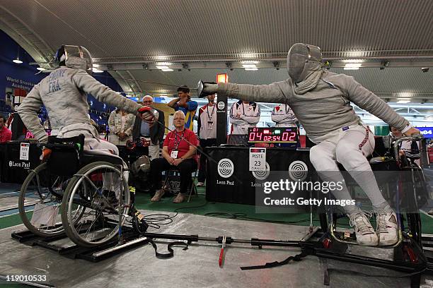 Tom Hall Butcher of Great Britain competes against Lemoine Ludovic of France in the Mens Wheelchair Sabre during the 2011 European Fencing...