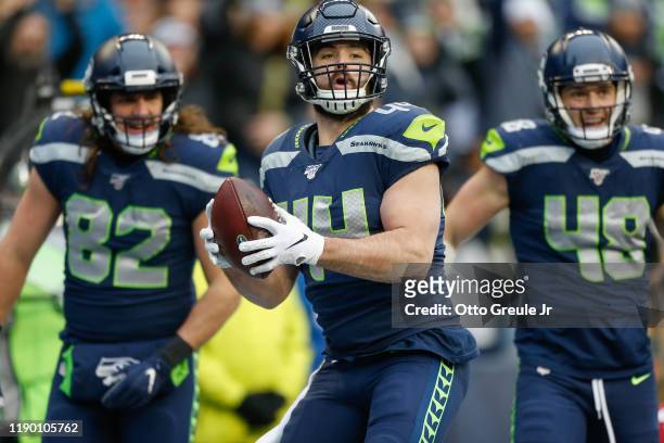 Fullback Nick Bellore of the Seattle Seahawks celebrates after scoring a touchdown in the first quarter against the Arizona Cardinals at CenturyLink...