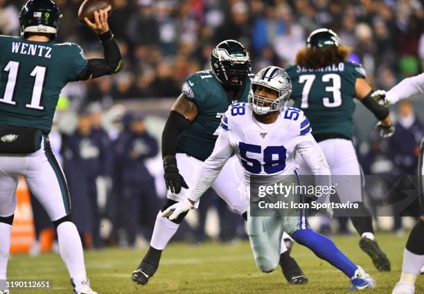 Dallas Cowboys Defensive End Robert Quinn rushes Philadelphia Eagles Quarterback Carson Wentz in the second half during the game between the Dallas...
