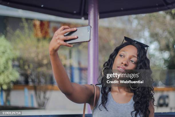 african girl taking a selfie - webfluential bildbanksfoton och bilder