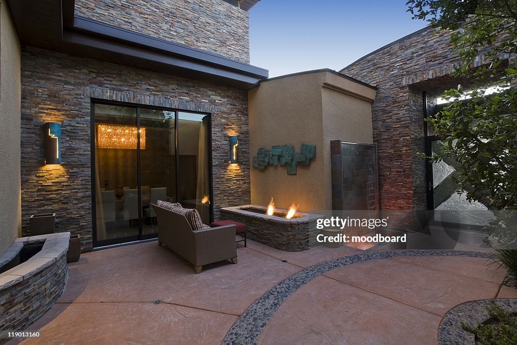 Exterior with patio furniture and lights