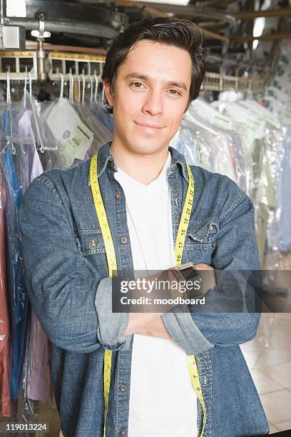 man working in the laundrette - fully unbuttoned stockfoto's en -beelden