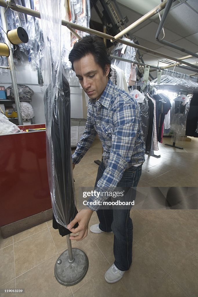 Man working in the laundrette