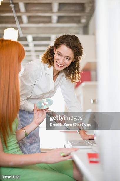 laughing businesswomen working together - white rom stock pictures, royalty-free photos & images