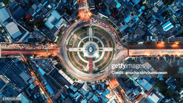 aerial top view of bangkok roundabout road at night, thailand. - busy highway stock pictures, royalty-free photos & images