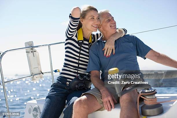 older couple sitting on boat - baby boomer stock pictures, royalty-free photos & images