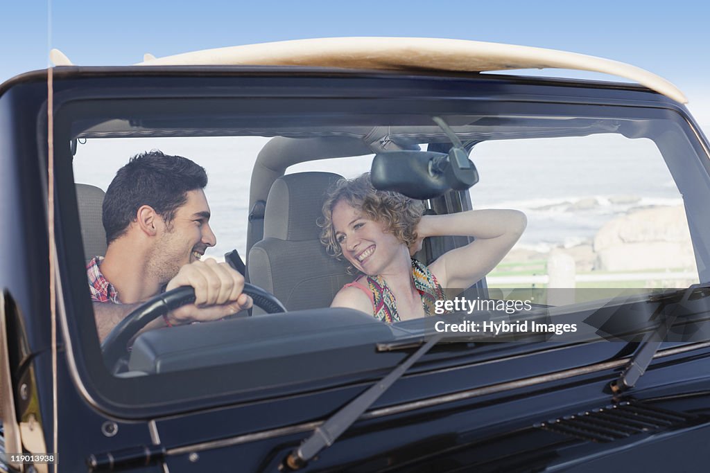 Couple riding in jeep together