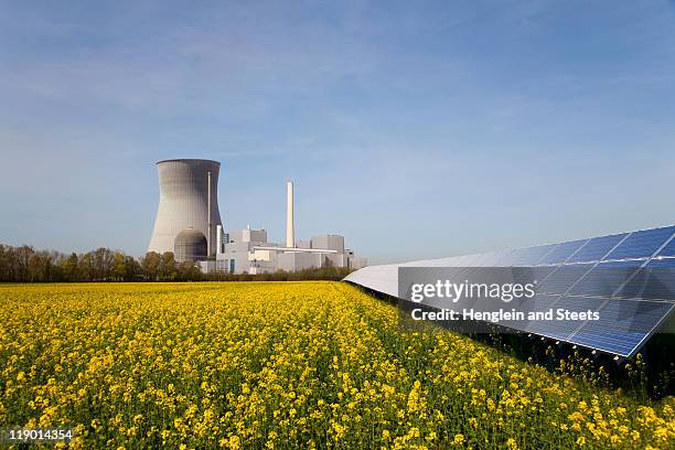 solar plant and atomic power station - centrale nucleare foto e immagini stock