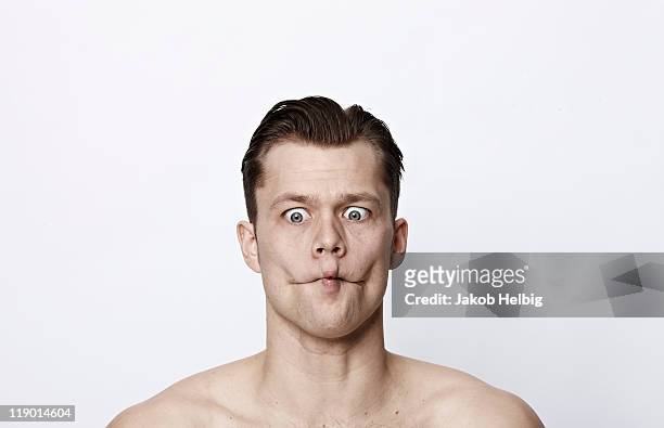 nude man making a funny face - sour taste bildbanksfoton och bilder