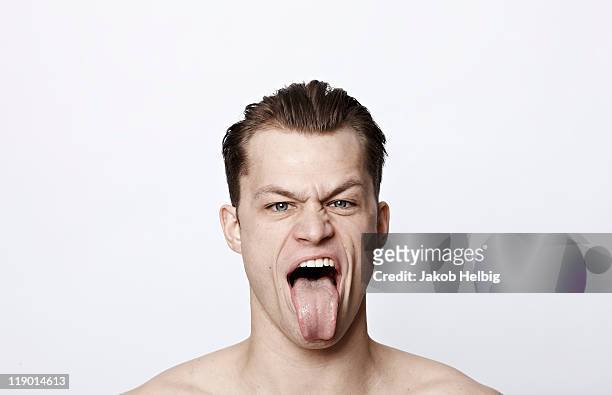 nude man making a funny face - sticking out tongue stock pictures, royalty-free photos & images