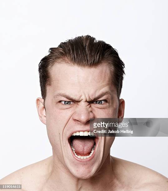 nude man making a funny face - mouth stockfoto's en -beelden