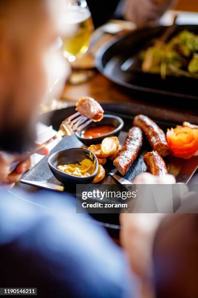 sausages with mustard in a pub - roast dinner pub stock pictures, royalty-free photos & images