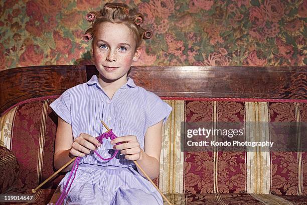 girl in rollers knitting - ball of wool stock pictures, royalty-free photos & images