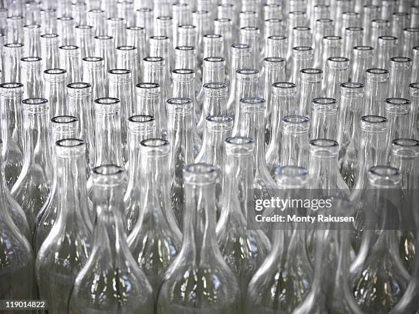 close up of empty bottles in plant - bottiglia vetro foto e immagini stock