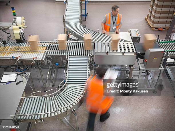 factory workers in bottling plant - making stock pictures, royalty-free photos & images
