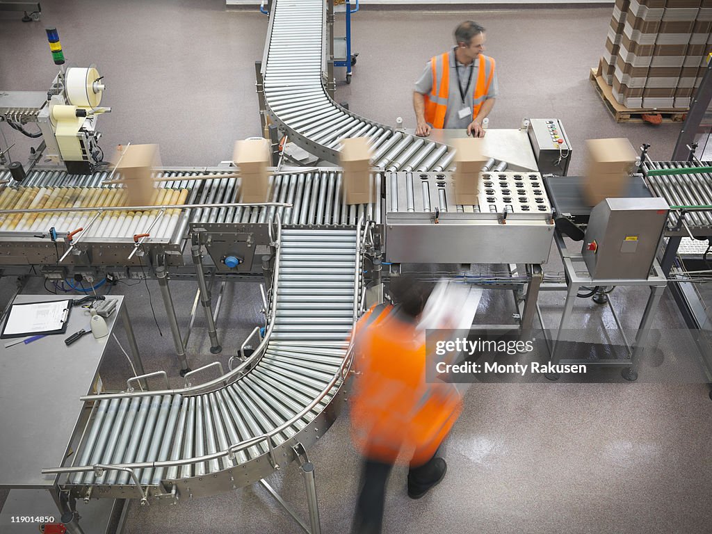 Factory workers in bottling plant