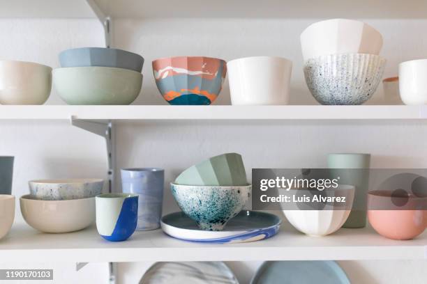 pottery workshop interior with pots on shelf - porslin bildbanksfoton och bilder