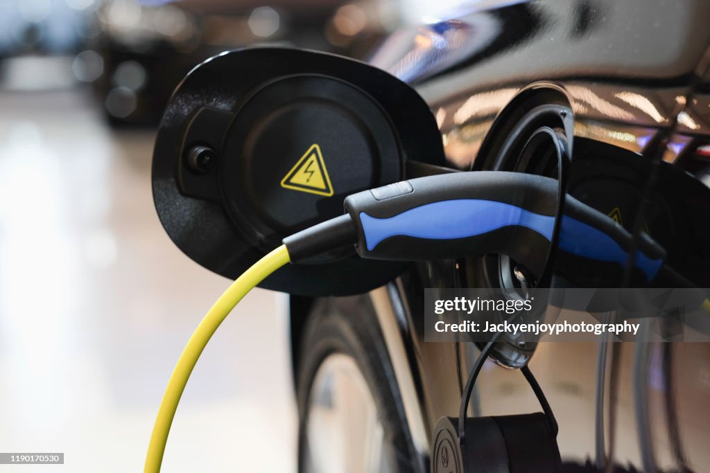 Battery charger in electric car at showroom