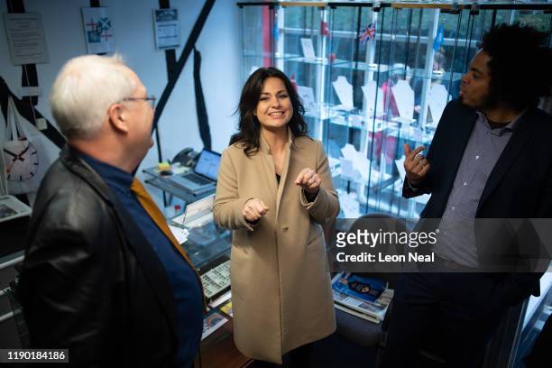 Former Conservative MP and Liberal Democrat member Heidi Allen speaks with a shop owner as she campaigns for Liberal Democrat Parliamentary candidate...